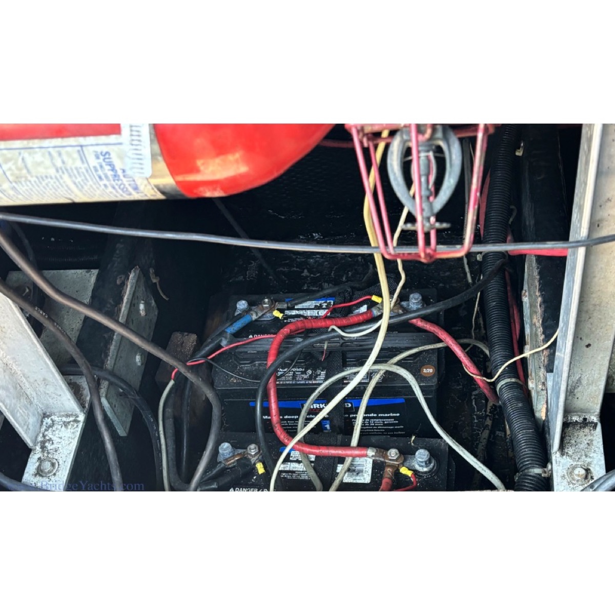 Marine battery wiring and electrical service access on a boat